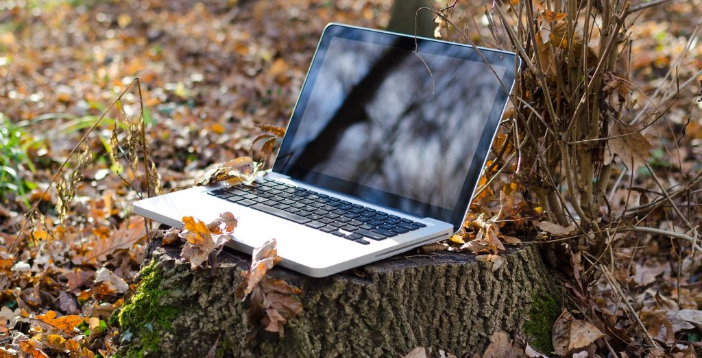 Laptop in a remote location in the woods